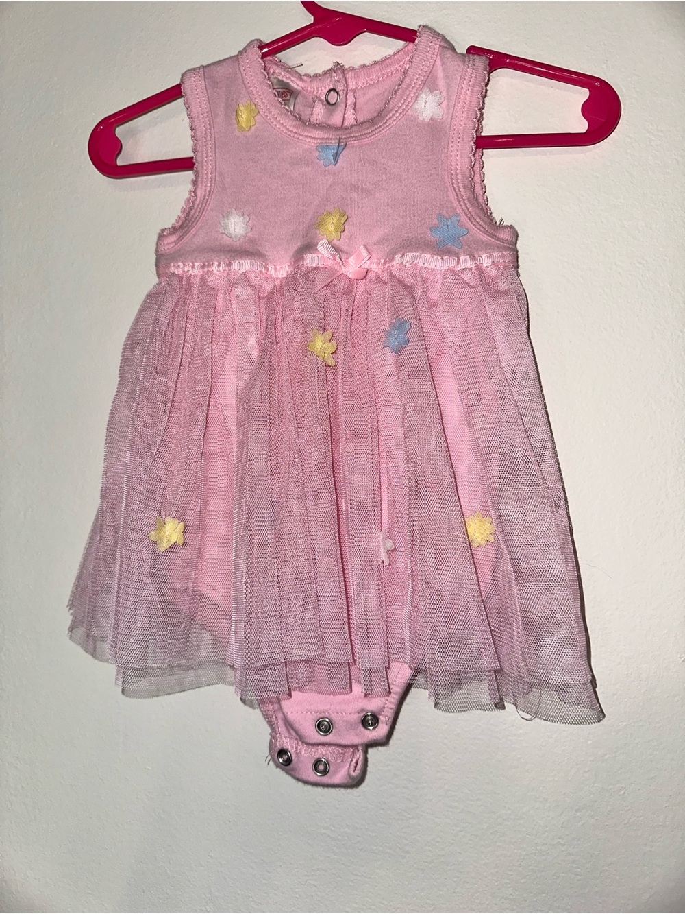 Swiggles Pink Baby Onesie with Pastel Flower Details